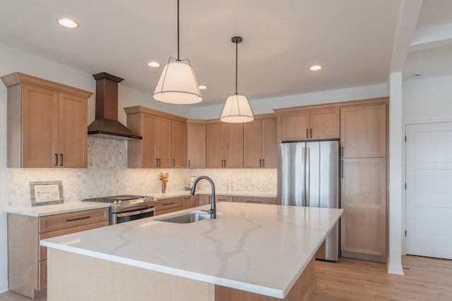 kitchen with a kitchen island with sink, stainless steel appliances, premium range hood, decorative backsplash, and sink