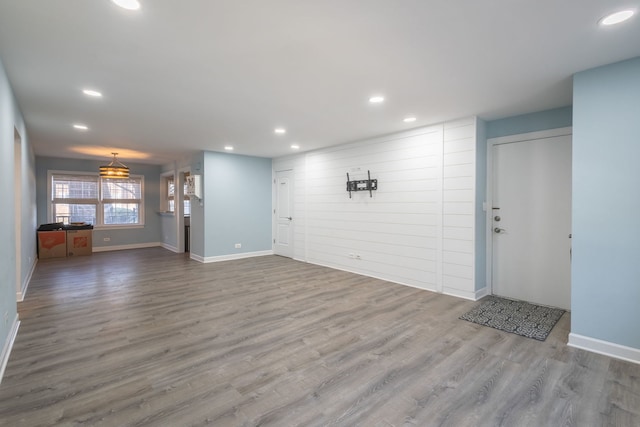 unfurnished living room with wood-type flooring