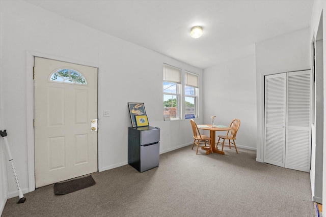 foyer featuring carpet