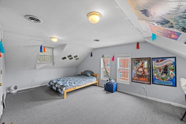 bedroom featuring carpet floors and vaulted ceiling