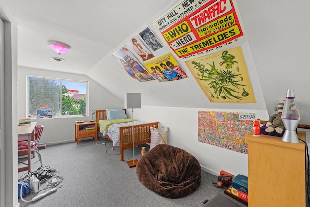 bedroom featuring lofted ceiling and carpet