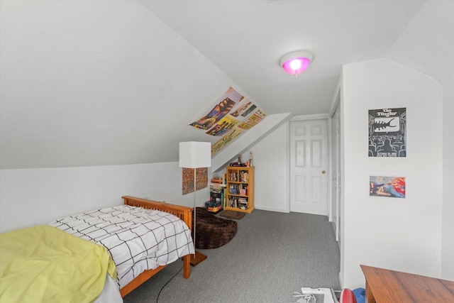 bedroom featuring lofted ceiling and carpet flooring