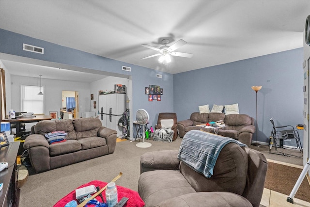 living room featuring ceiling fan and light colored carpet