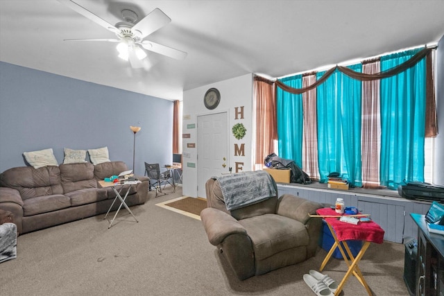 living room featuring carpet floors and ceiling fan