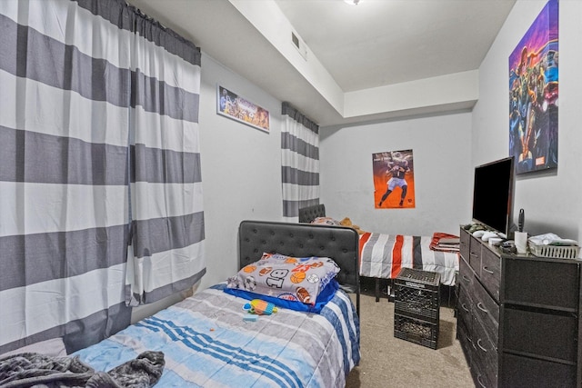 bedroom with light colored carpet