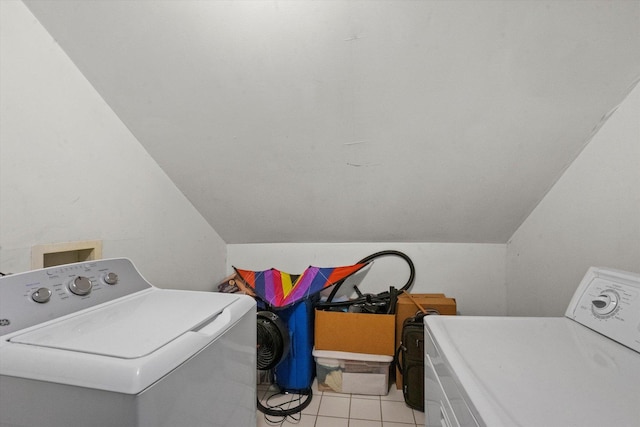 washroom with washer and dryer and light tile patterned floors