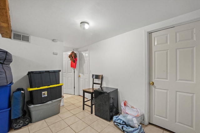 misc room with light tile patterned floors