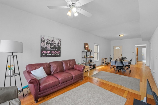 living room featuring ceiling fan and hardwood / wood-style flooring