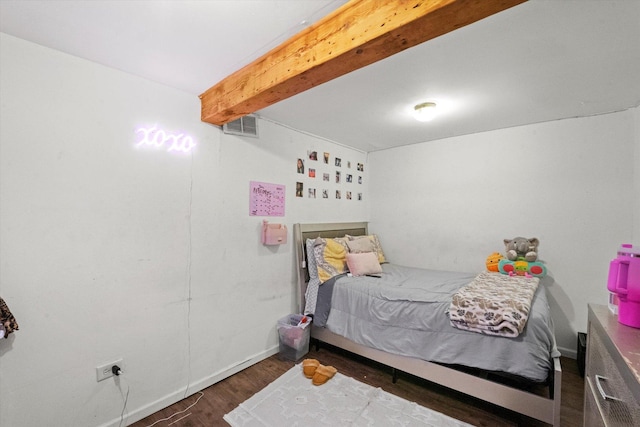 bedroom with dark wood-type flooring