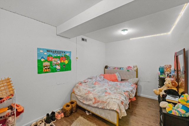 bedroom featuring hardwood / wood-style floors