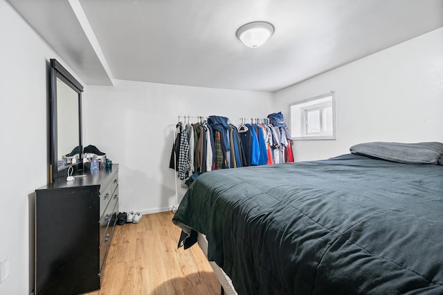 bedroom with light hardwood / wood-style flooring