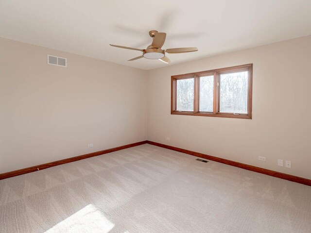 unfurnished room with ceiling fan, a skylight, high vaulted ceiling, and beam ceiling