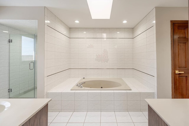 bathroom featuring tile patterned flooring, separate shower and tub, and vanity