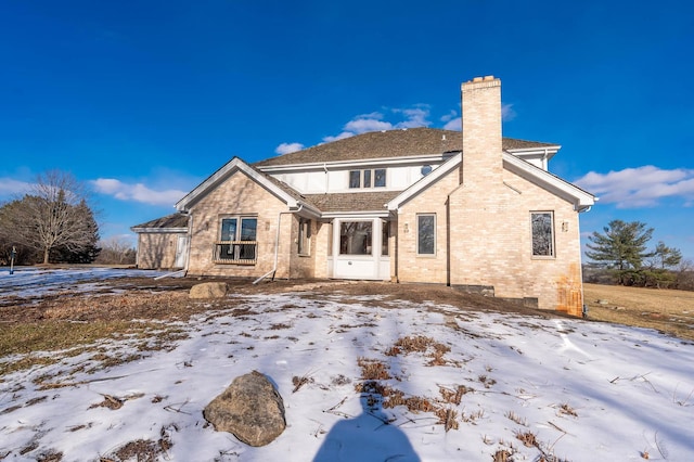 view of snow covered house