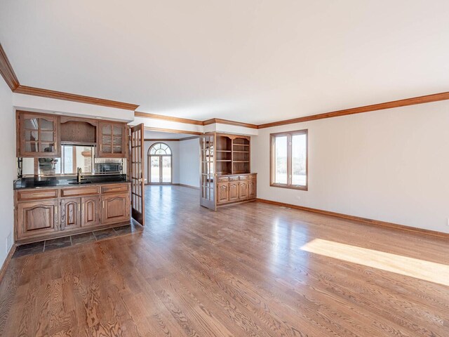 kitchen featuring light wood-type flooring and built in desk