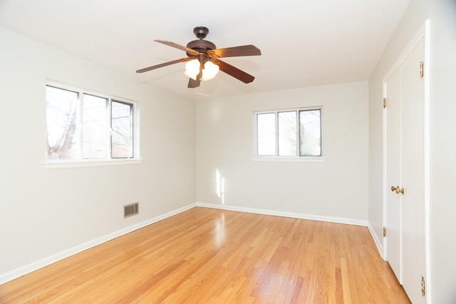 spare room with ceiling fan and light hardwood / wood-style floors