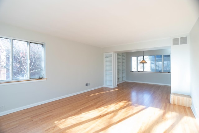 spare room with hardwood / wood-style flooring