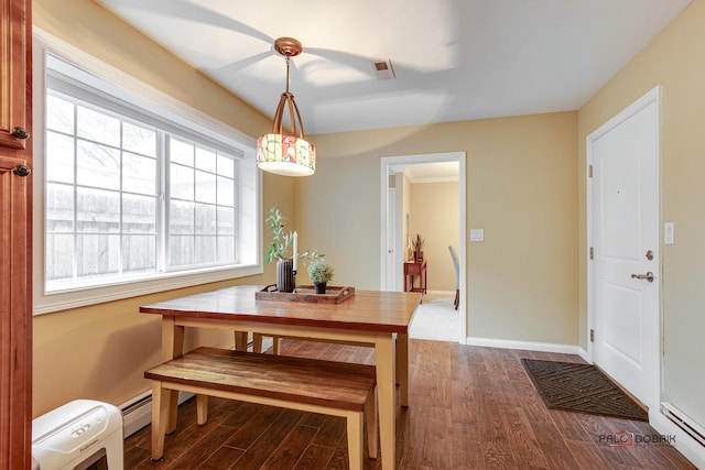 dining area with baseboard heating and hardwood / wood-style flooring