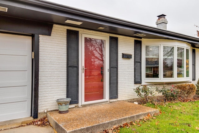 property entrance with a garage