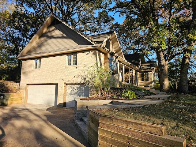 view of side of property with a garage