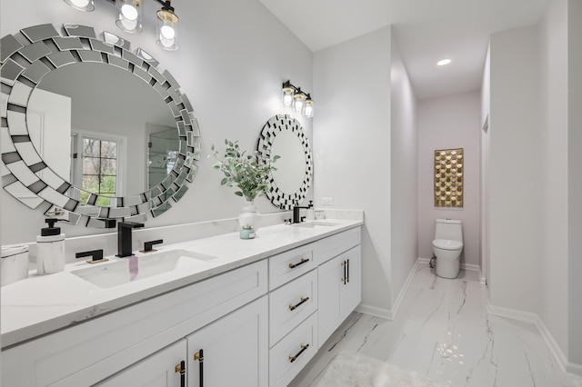 bathroom with toilet and vanity