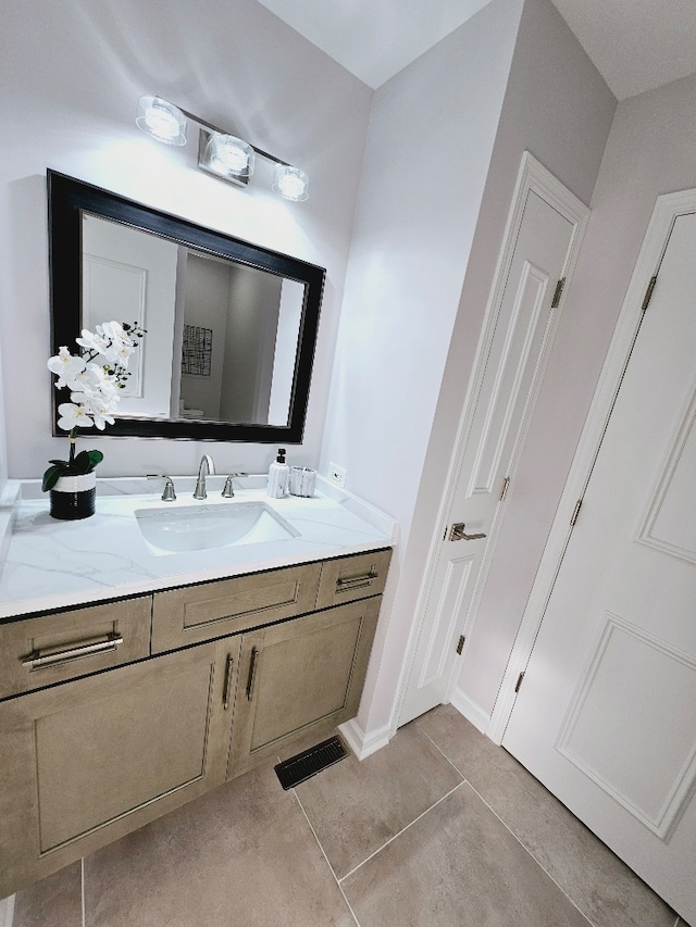 bathroom with vanity and tile patterned flooring