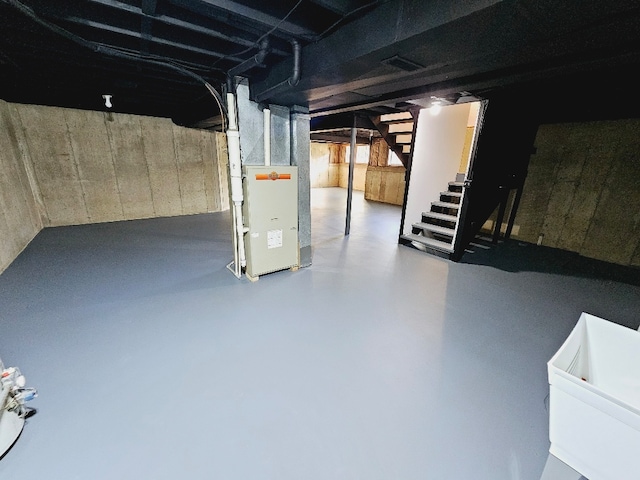 basement featuring heating unit