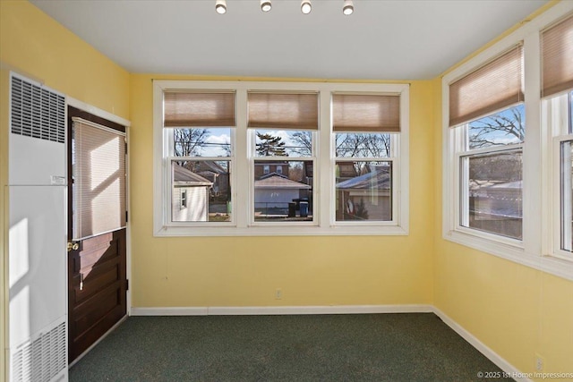 unfurnished sunroom with plenty of natural light