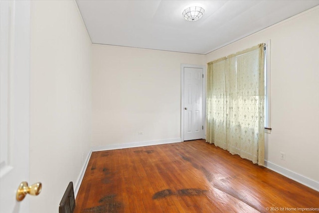 unfurnished bedroom featuring hardwood / wood-style floors