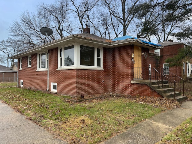 view of home's exterior featuring a yard