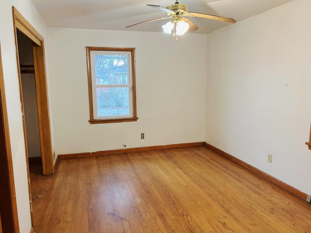 unfurnished bedroom featuring a closet, ceiling fan, and light wood-type flooring