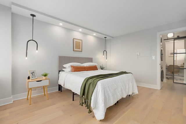 bedroom with light hardwood / wood-style flooring