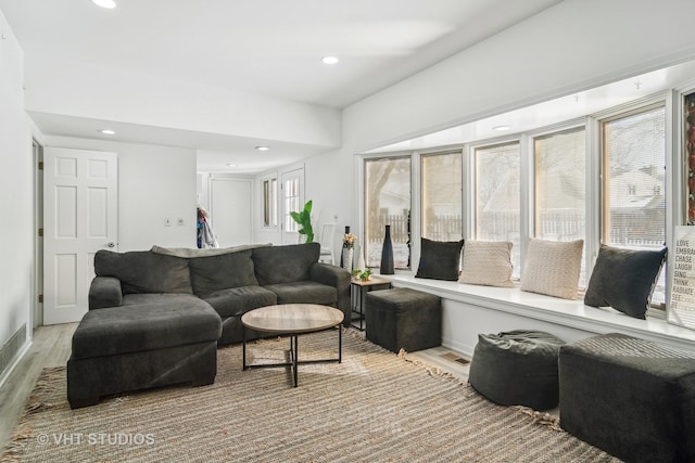 living room with light hardwood / wood-style flooring