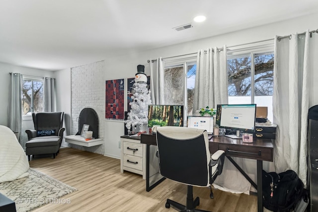 office with light hardwood / wood-style floors