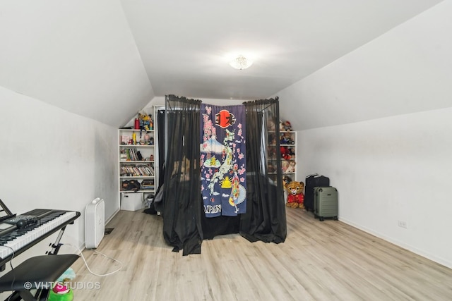 interior space featuring vaulted ceiling and light wood-type flooring