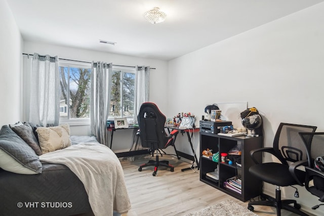 bedroom featuring light wood-type flooring