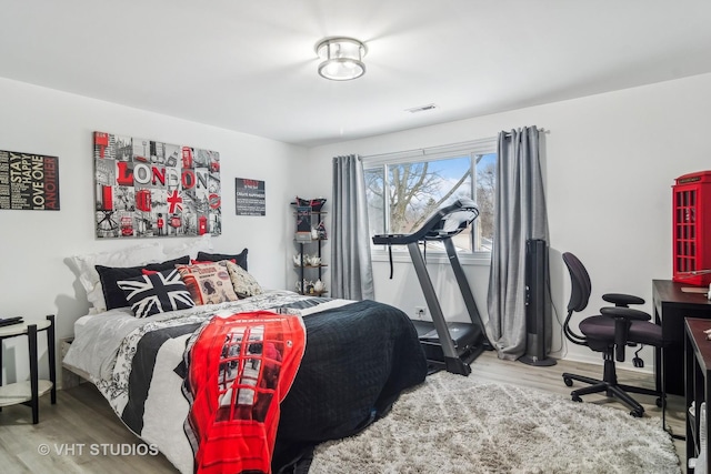 bedroom with light wood-type flooring