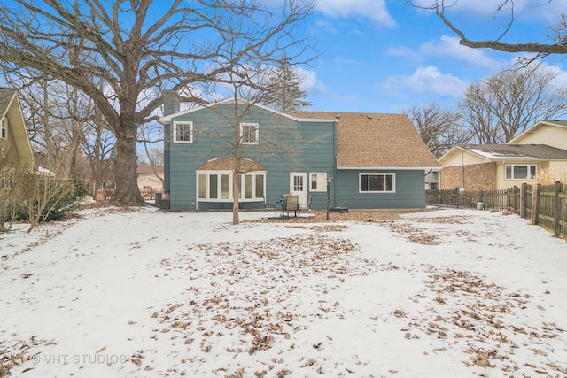 view of snow covered house