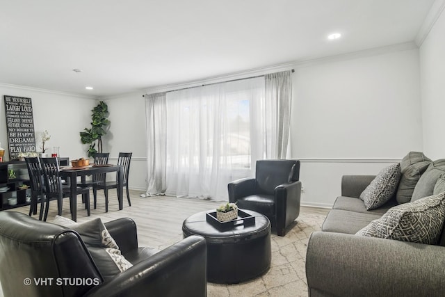 living room with ornamental molding and light wood-type flooring