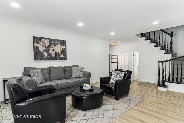 living room featuring crown molding and wood-type flooring