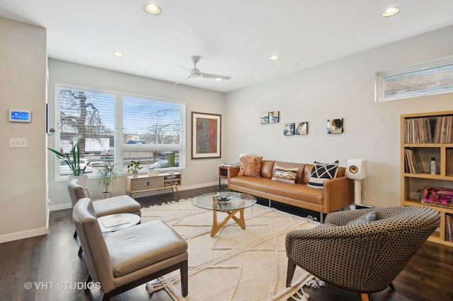 living room with dark wood-type flooring and ceiling fan