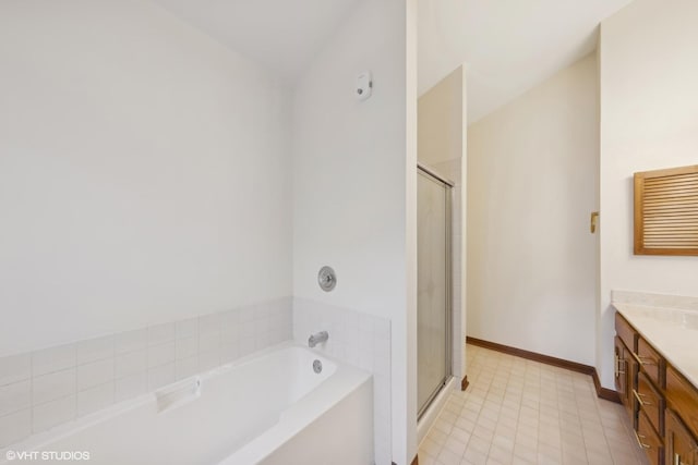 bathroom with vanity, tile patterned floors, and separate shower and tub