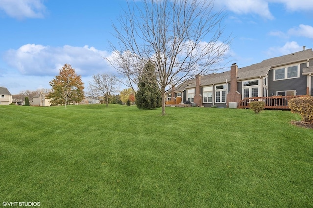 view of yard with a deck