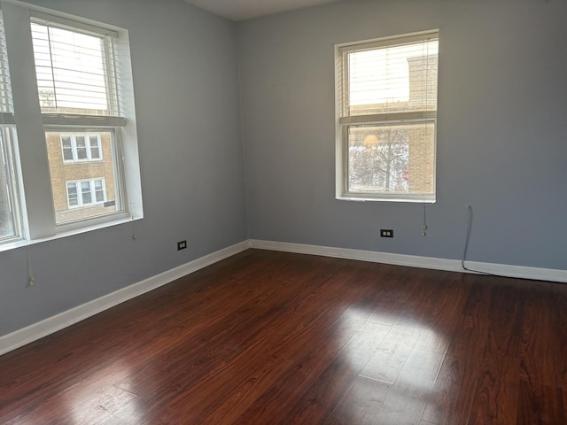 unfurnished room featuring dark hardwood / wood-style flooring