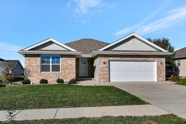 view of front of house with a front lawn and a garage