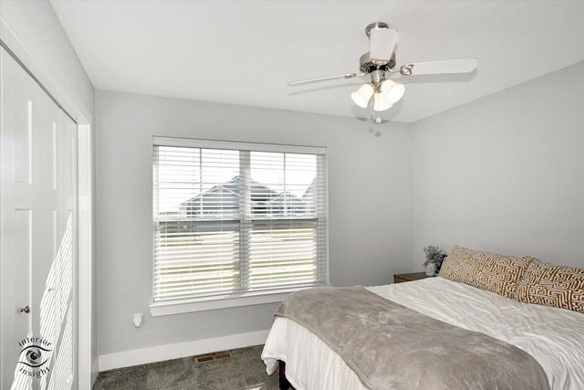 carpeted bedroom with a closet and ceiling fan