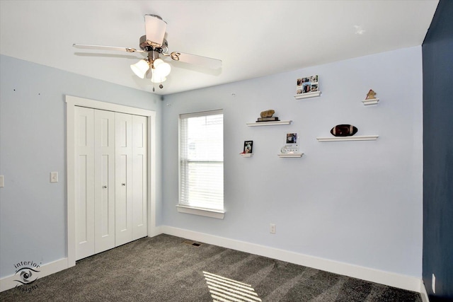 unfurnished bedroom featuring a closet, ceiling fan, and carpet floors