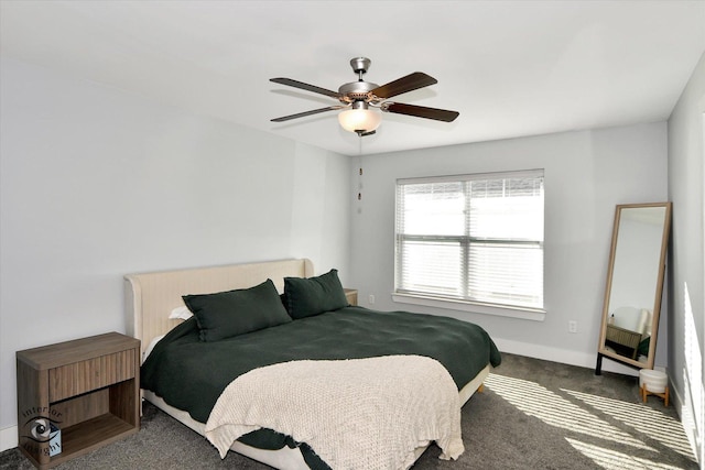 bedroom featuring dark carpet and ceiling fan