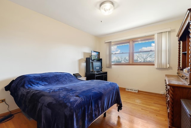 bedroom with light hardwood / wood-style flooring