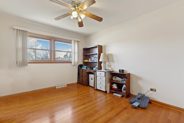 misc room with ceiling fan and light hardwood / wood-style floors